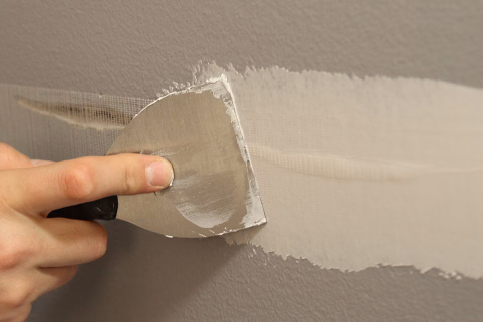 Hoe kan ik een plamuurmes gebruiken om te verven?